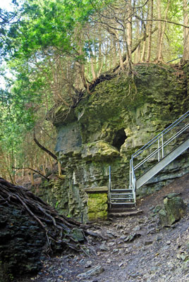 a hole in the rock of the gorge cliff